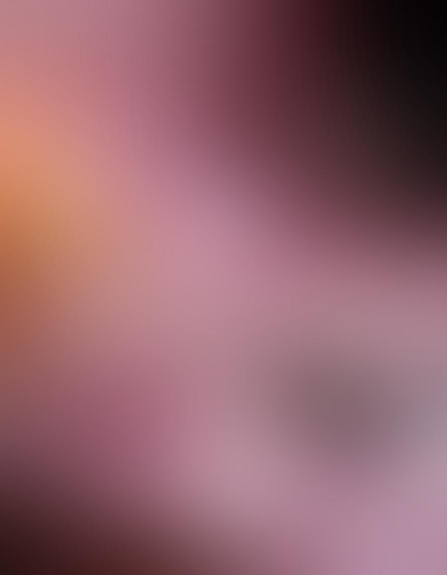 A whimsical, inviting scene featuring an assortment of elegantly designed adult toys and intimacy products displayed tastefully on a soft satin fabric. The ambiance is warm and cozy, with a hint of candlelight and rose petals in the background, evoking a sense of intimacy and exploration. A pair of hands gently reaching for the products adds a tactile element to the image. Sensual, playful color tones with a focus on pinks and reds create an engaging atmosphere. super-realistic. vibrant colors. soft lighting.